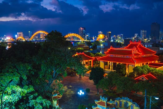 Da Nang city with Dragon Bridge in Vietnam. Panorama of the night city in Asia