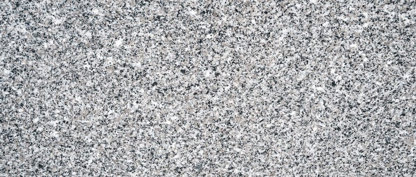 background with a white granite stone texture with black speckles for paving slabs