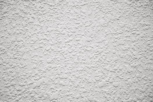 white background with textured plaster pattern. Abstract light background