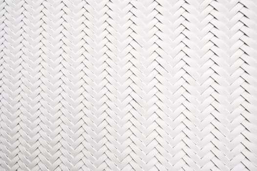 abstract white background with artificial plastic texture of woven rattan. Abstract braided Pattern
