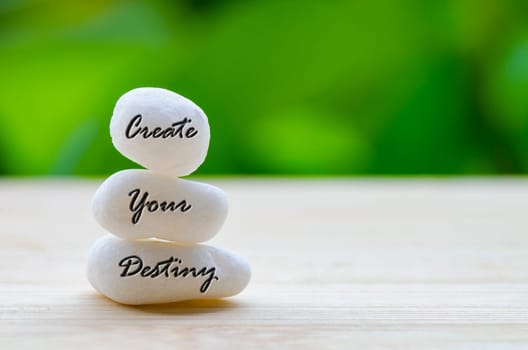 Create your destiny text on the white Zen stones. Life destiny concept.