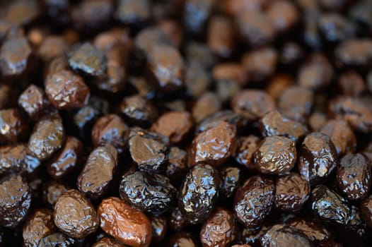 Luscious, shiny dried fruits are displayed together, offering a tempting treat for health-conscious food lovers.
