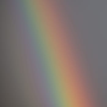 A rainbow against a grey sky in eastern Finland in summer