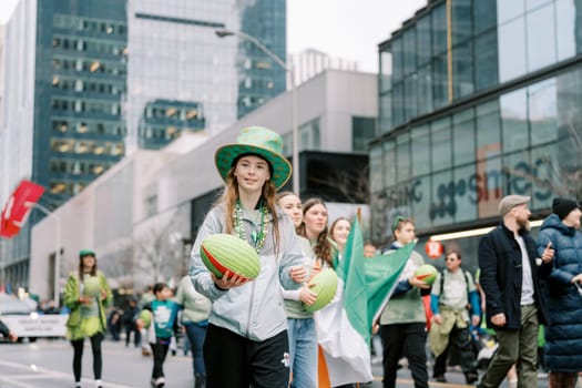 Festive participants in green gather to celebrate the joyful St. Patricks Day parade