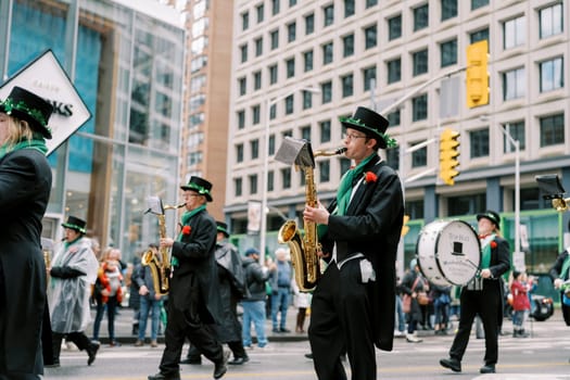 A colorful parade showcases talented musicians in festive attire celebrating culture