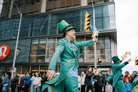 Participants in green costumes enthusiastically celebrate the joyful Saint Patricks Day