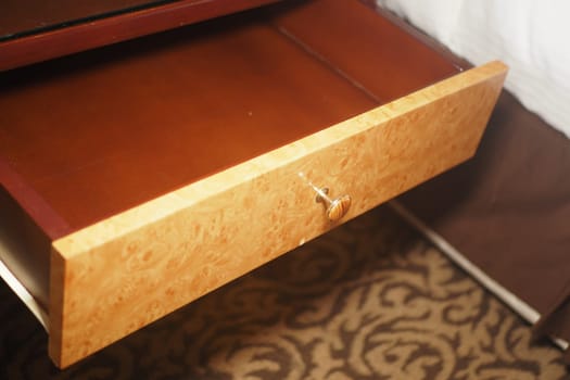 Close-up of a wooden drawer showcasing its intricate design and texture.