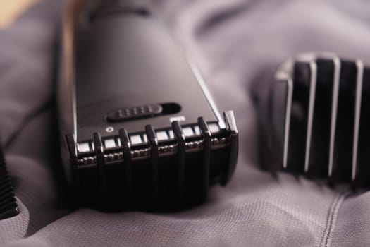 Grooming devices are arranged neatly on a soft fabric, showing detail.