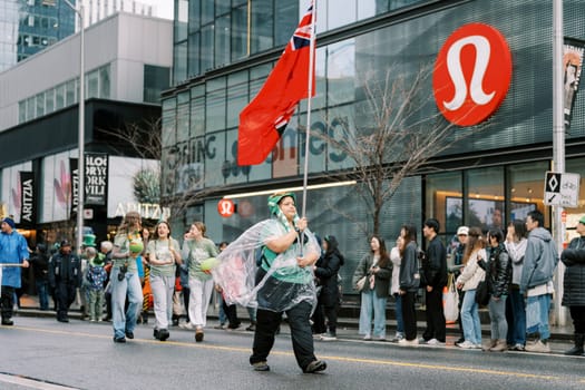 A colorful parade with flag bearers and an enthusiastic crowd, creating festivity