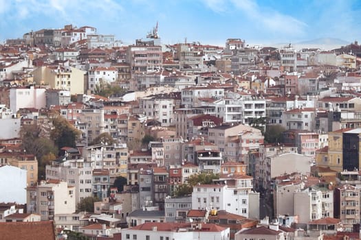 A vibrant neighborhood showcases colorful buildings and blue skies.