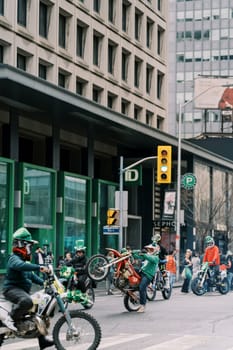 Motorcycles along with riders were showcased in a vibrant and dynamic urban setting