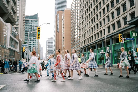 Dynamic street performance showcasing diverse dancers in vibrant attire