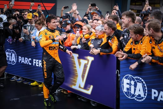 Lando Norris of Great Britain and McLaren Formula 1 Team celebrates winning the Australian Formula 1 Grand Prix with his team at Albert Park in Melbourne, Australia