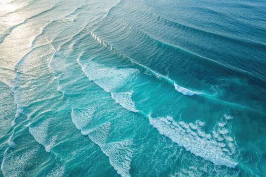 Gentle waves roll across the serene turquoise waters, reflecting the soft sunlight. The rhythmic patterns create a mesmerizing visual symphony, evoking tranquility and peace at the coast.