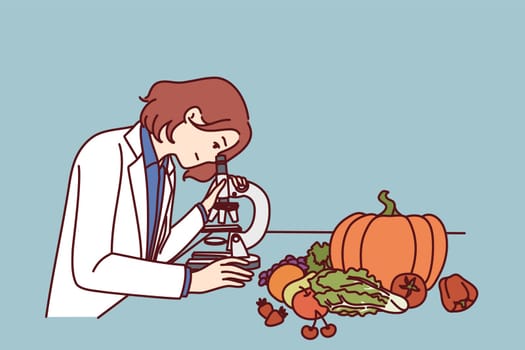 Checking quality of food in laboratory by woman using microscope to look for nitrates and pesticides. Girl scientist controls quality of products of grocery store and works in field of food technology