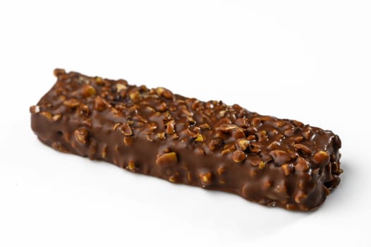 Rich chocolate envelops a crunchy nut-filled treat, inviting cravings and delighting taste buds in every bite.