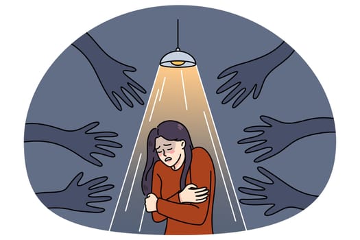 Terrified woman stand under spotlight haunted by numerous black hands. Unhappy scared girl suffer from psychological problems, have fears and anxiety. Vector illustration.