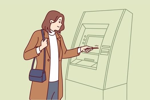 Woman uses atm to withdraw cash from credit card for shopping in stores or paying for services. Woman stands near atm, wanting to check amount of money in account or replenish deposit.