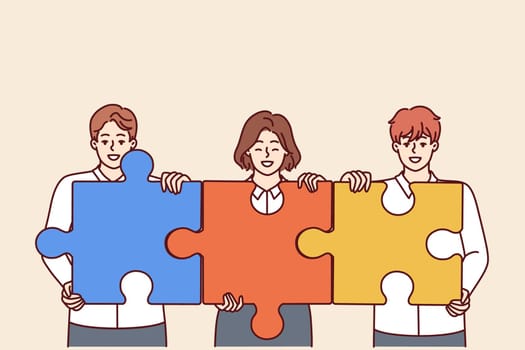Team of businesspeople with puzzles symbolizing teamwork and collaboration to achieve business goals. Office workers call for collaboration for productive teamwork and company development