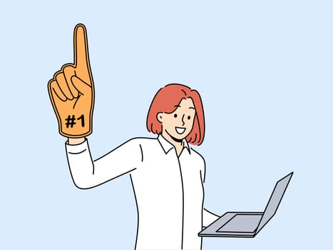 Woman leader with laptop and giant champion hand symbolizing success in internet career. Ambitious girl wants to become leader by working as freelancer through computer or creating online startup.