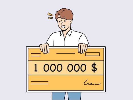 Happy man holding million dollar certificate rejoicing in winning lottery or casino. Lucky young guy with giant check for million dollars smiles after winning cash prize in competition.