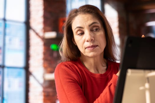 Female new hire attending a virtual meeting with her business trainer, showcasing the effectiveness of online tools and internet connection. Woman starting her training session for the new job.