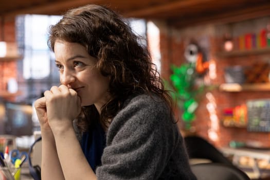Stock market investor monitors charts and candlestick patterns and being pleased, watching the profit value increase. Thrilled enthusiastic woman reviews statistics and manages risks.