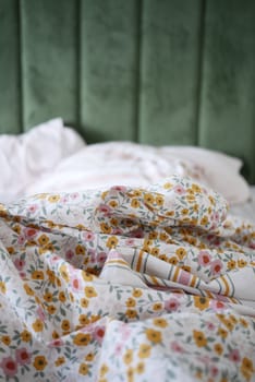 Soft floral sheets create a warm and inviting atmosphere in a bedroom.
