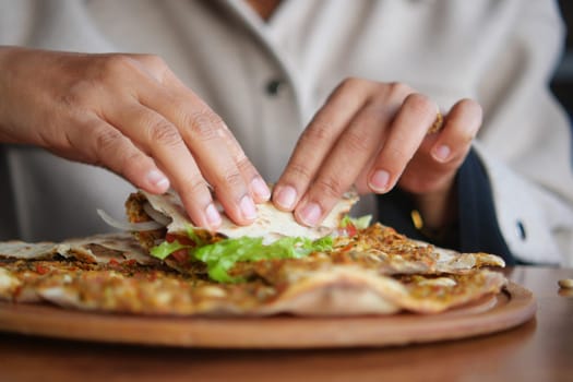 woman Preparing fresh turksih Lahmacun .