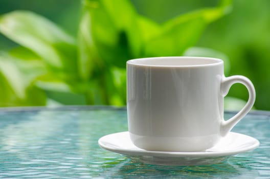 Side view of white cup with customizable space for mockup. Copy space and mockup concept.