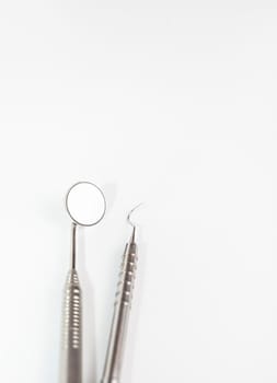 Isolated Basic Dental Instruments Set, Mirror, Explorer. Oral Hygiene Mockup, Dental Care. Healthcare. Vertical. Copy Space High quality photo