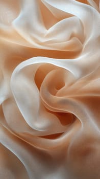 Delicate peach and white fabric is elegantly arranged, showcasing its smooth texture and flowing drapes. The soft hues blend beautifully, creating a serene aesthetic.