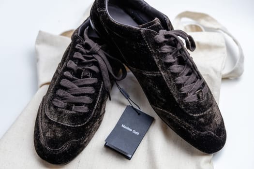 Trendy brown colored sneakers from Massimo Dutti. Copenhagen, Denmark - March 15, 2025