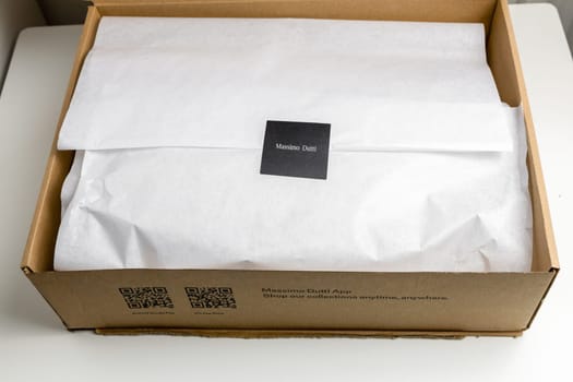 Box with an order from the fashion store Massimo Dutti. Copenhagen, Denmark - March 15, 2025