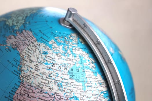 Close-up view of Globe pointing at Canada. Copenhagen, Denmark - March 15, 2025