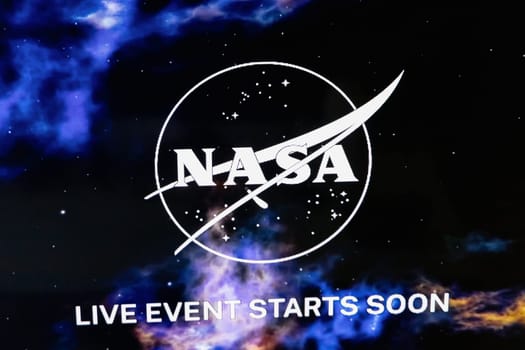 NASA logo with space background. Space travel concept. Copenhagen, Denmark - March 15, 2025