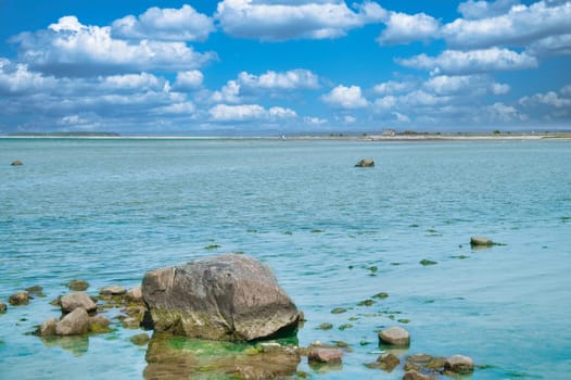 Stones and rocks on the Baltic coast in the sea. Landscape shot in sunshine. Nature from germany