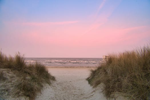 Beach crossing on the island of Usedom to the Baltic Sea. White sand and dune grass. Nature photo from a German island