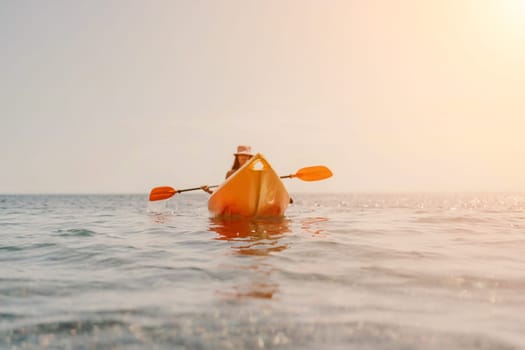 Kayak sea woman. Happy attractive woman with long hair in red swimsuit, swimming on kayak. Summer holiday vacation and travel concept
