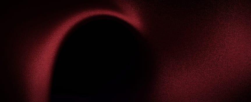 A close-up of a red and black abstract background with a shape and a soft gradient.