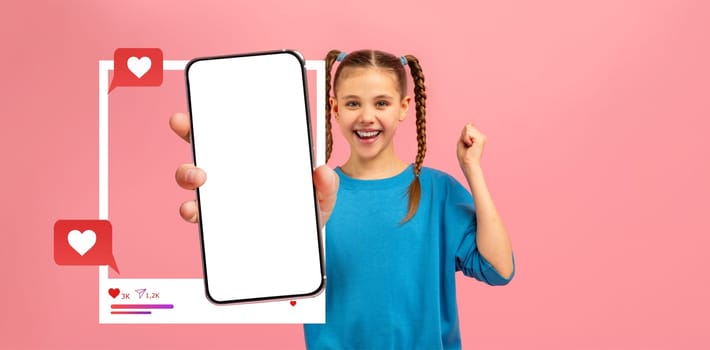 A teen girl young influencer happily presents a smartphone with a blank screen, expressing excitement about social media interaction.