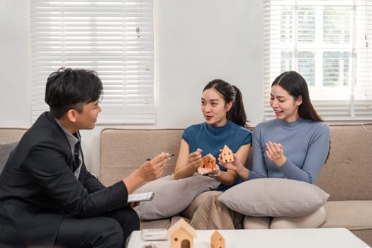 In a vibrant setting, clients share their thoughts on potential properties while engaging with a real estate agent