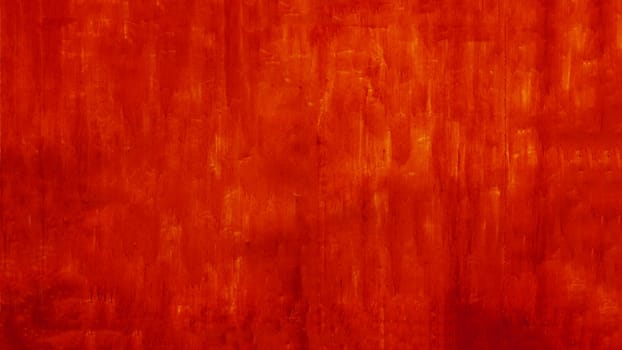 Texture of worn red paint on the wall. Metal plate covered with red paint.