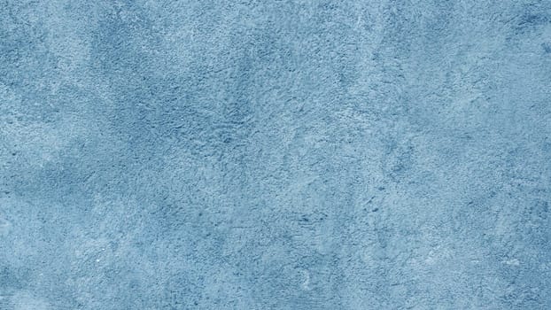 Close-up of an urban grunge textured background in blue.