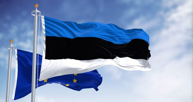 The flags of Estonia and the European Union waving together on a clear day. Estonia became a member of the European Union on May 1, 2004. Realistic 3d illustration. International treaty and diplomacy