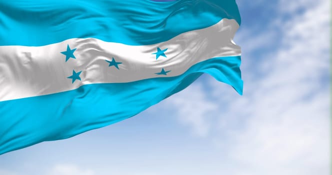 Flag of Honduras waving against a clear sky. Symbol of national pride, identity, and independence. Seamless 3d render animation. Slow motion loop. Selective focus. Fluttering fabric. Close-up