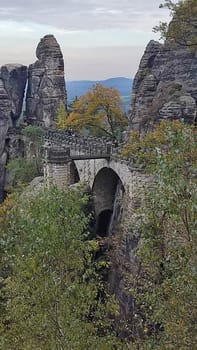 Stone arch bridge shotlisttravel nature travel tourism summer day park pravcicka brana road blue sky landscape . High quality photo Czech Republic Europe trees