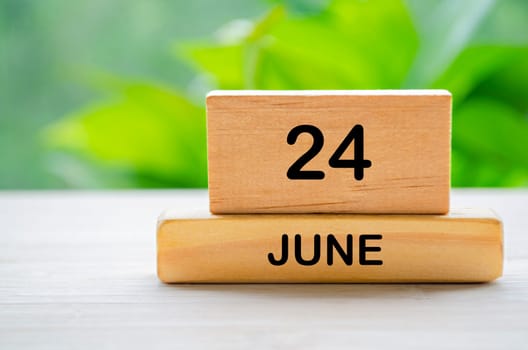 24 June wooden calendar with customizable space for text or ideas. June month concept