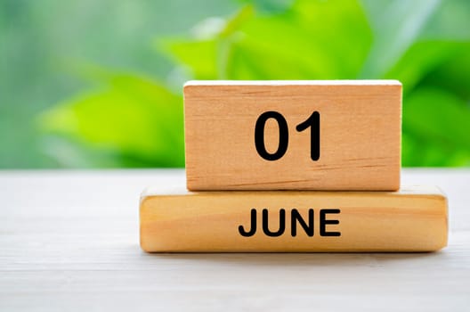1 June wooden calendar with customizable space for text or ideas. June month concept