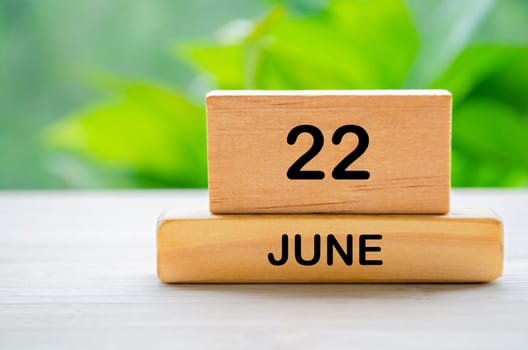 22 June wooden calendar with customizable space for text or ideas. June month concept
